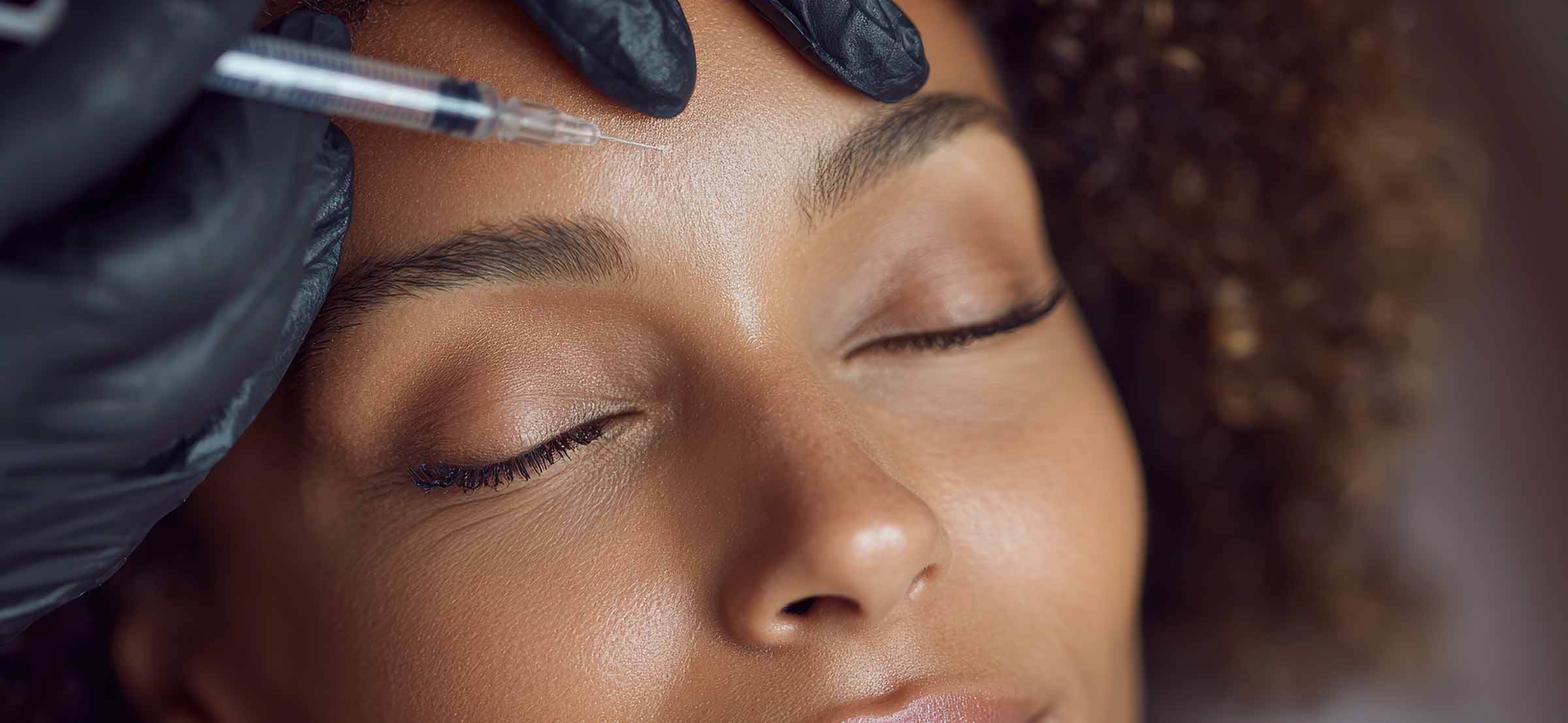 woman receiving cosmetic skincare treatment